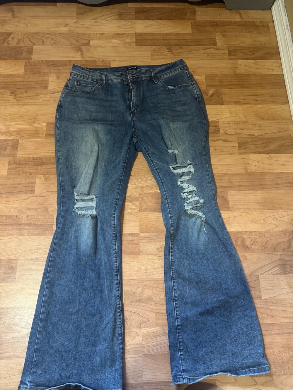 Distressed Flare Jeans in Medium Blue